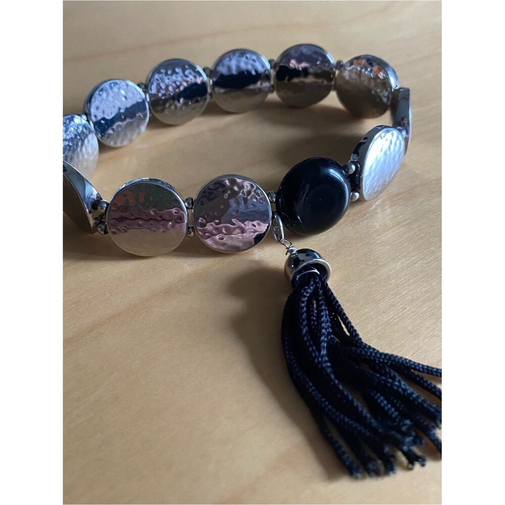 Silver toned elastic beaded tassel bracelet